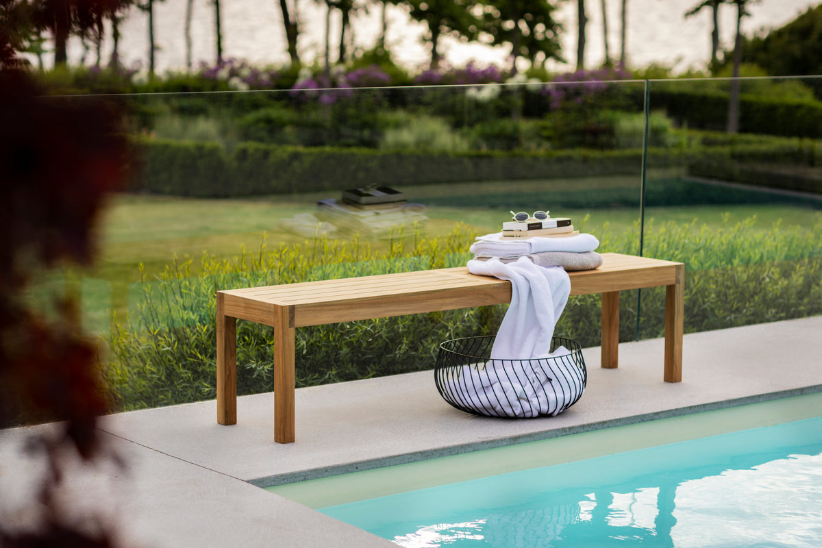 Laknäs teak bench by the pool
