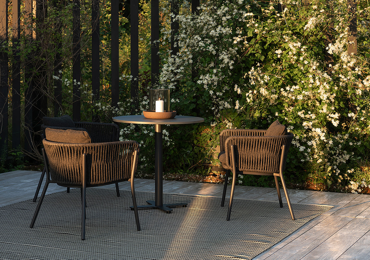 Tira armchairs under a pergola