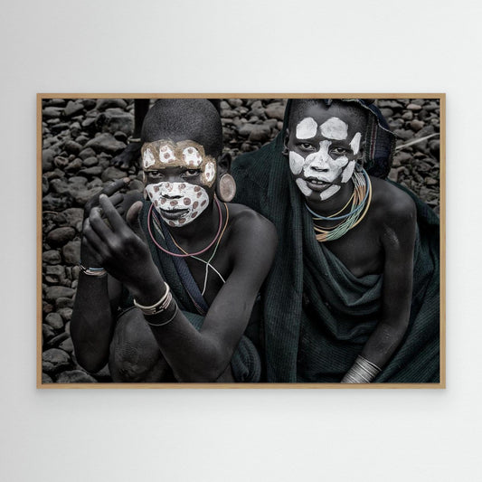 Two surmi girl painting in the bank of a river - Ethiopia by Joxe Inazio Kuesta Garmendia