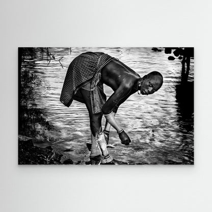 Surma Tribe Woman Washing up her Jewelry - Ethiopia by Joxe Inazio Kuesta Garmendia