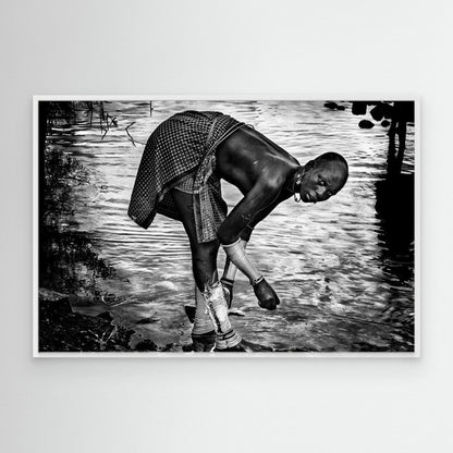 Surma Tribe Woman Washing up her Jewelry - Ethiopia by Joxe Inazio Kuesta Garmendia