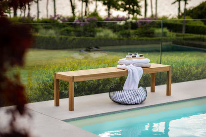 Laknäs teak bench by the pool