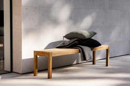 Laknäs bench by a wall