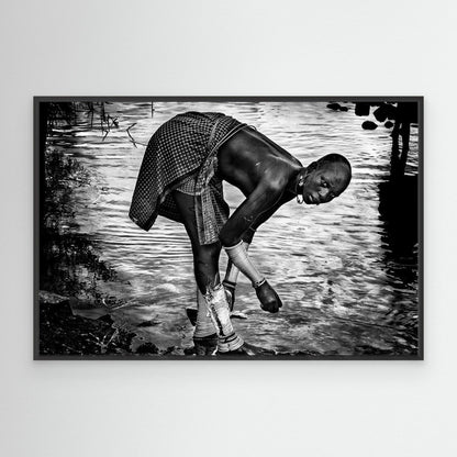 Surma Tribe Woman Washing up her Jewelry - Ethiopia by Joxe Inazio Kuesta Garmendia