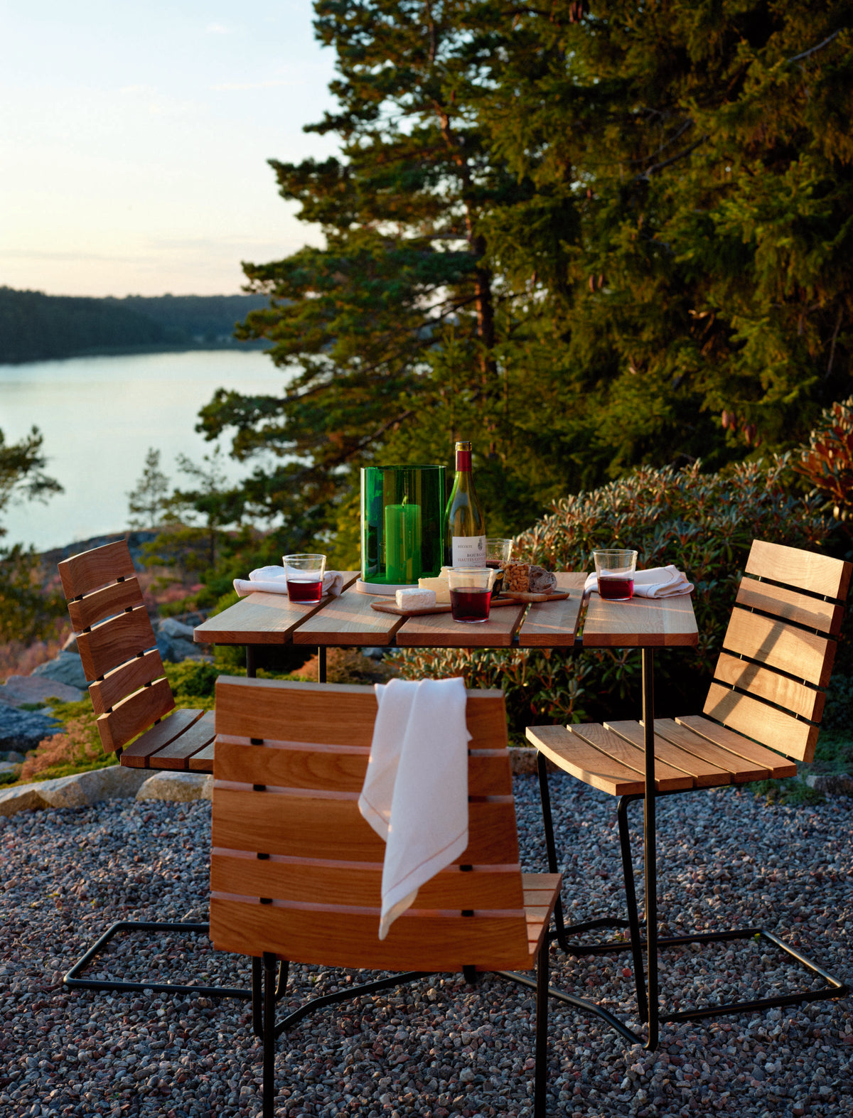 Grinda teak armchairs around a table for four