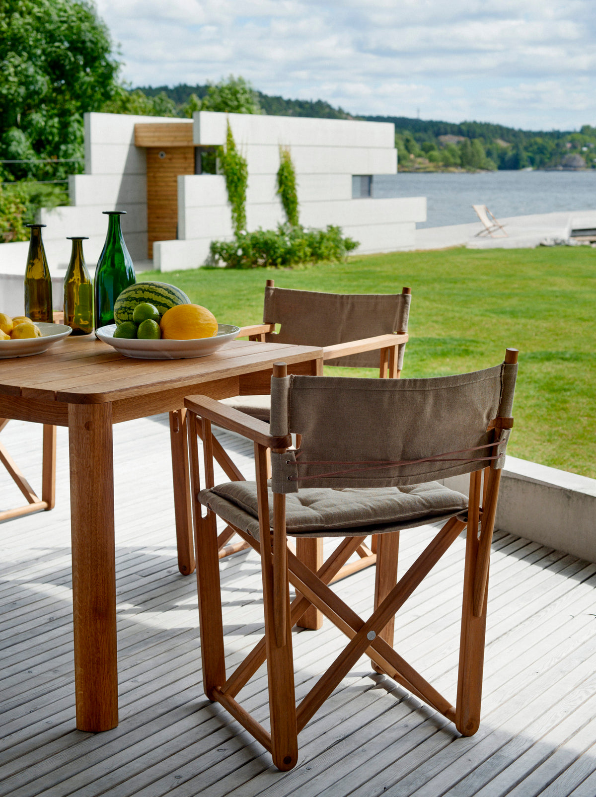 Kryss teak dining chairs by Björn Hultén around a dining table
