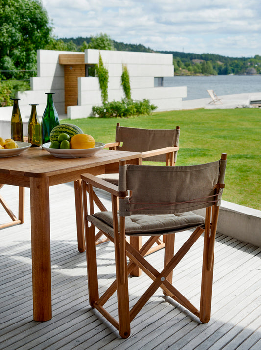 Kryss teak dining chairs by Björn Hultén around a dining table