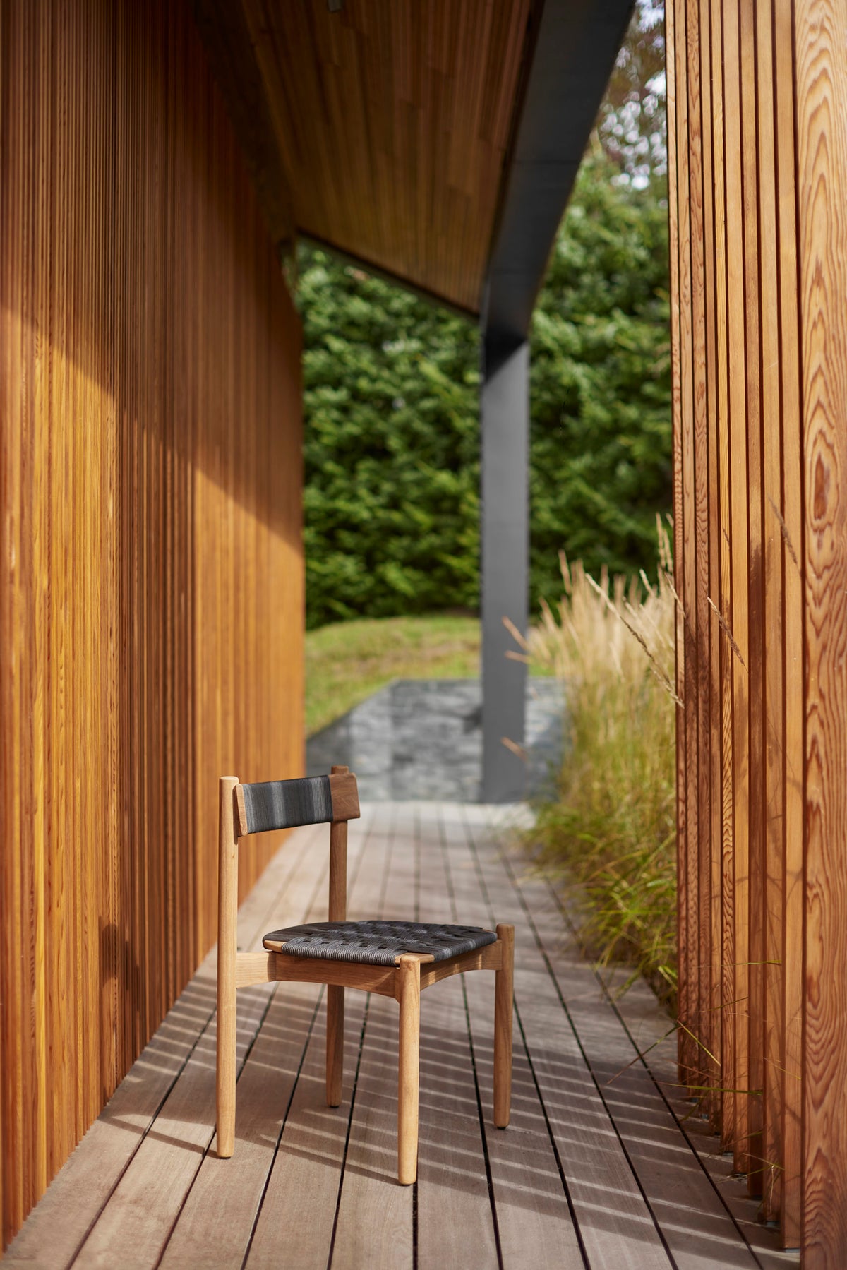 Koster dining chairs around a teak table
