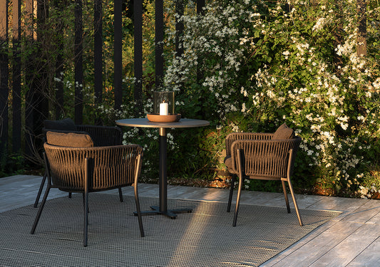 Tira armchairs under a pergola