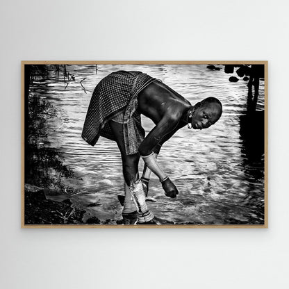 Surma Tribe Woman Washing up her Jewelry - Ethiopia by Joxe Inazio Kuesta Garmendia